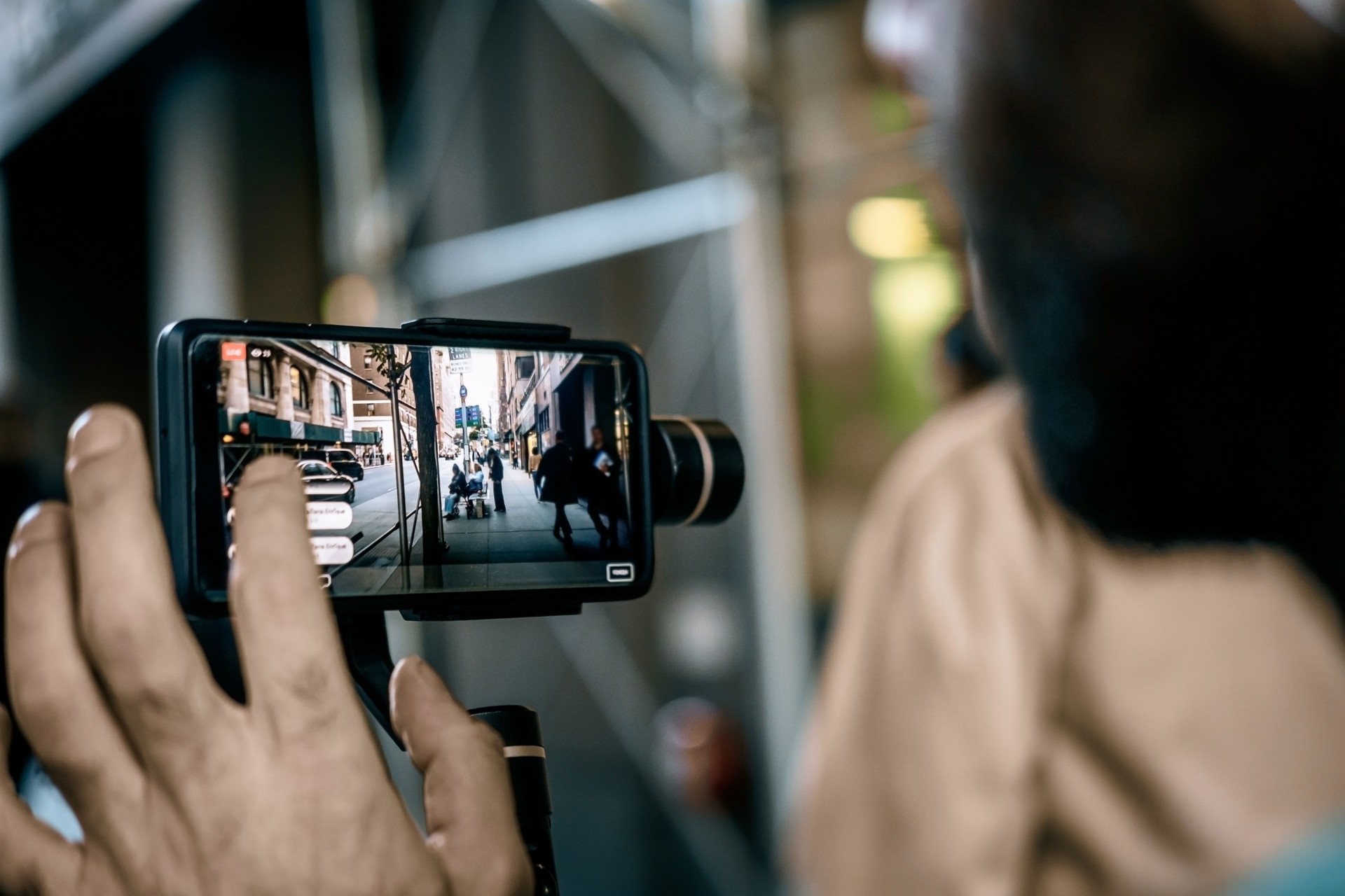 Man doing live video with phone with stabilizer  in NY